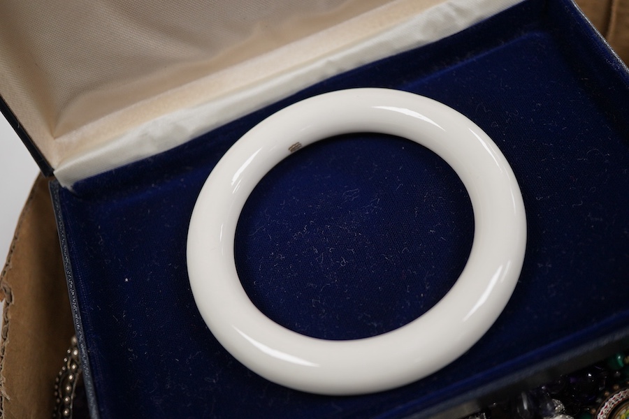 A collection of costume jewellery to include a yellow metal and amethyst ring, two George V silver and guilloche enamel brooches, two amethyst necklaces, etc